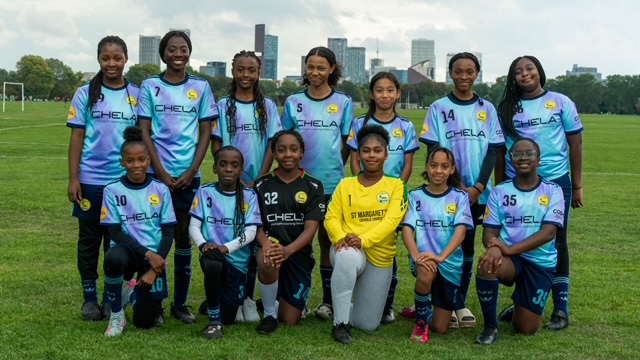 A girls' football team in their squad kit